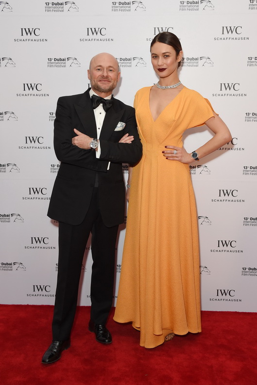 DUBAI, UNITED ARAB EMIRATES - DECEMBER 08: Georges Kern (L), CEO IWC Schaffhausen and Olga Kurylenko (R), actress and model attends the fifth IWC Filmmaker Award gala dinner at the 13th Dubai International Film Festival (DIFF), during which Swiss luxury watch manufacturer IWC Schaffhausen celebrated its long-standing passion for filmmaking at One And Only Royal Mirage on December 8, 2016 in Dubai, United Arab Emirates. (Photo by Anthony Harvey/Getty Images)